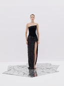 A Black Strapless Gown with a High Slit and Textured Skirt